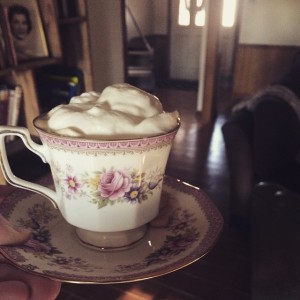 Mom enjoys an afternoon espresso with billows of whipped cream on top!